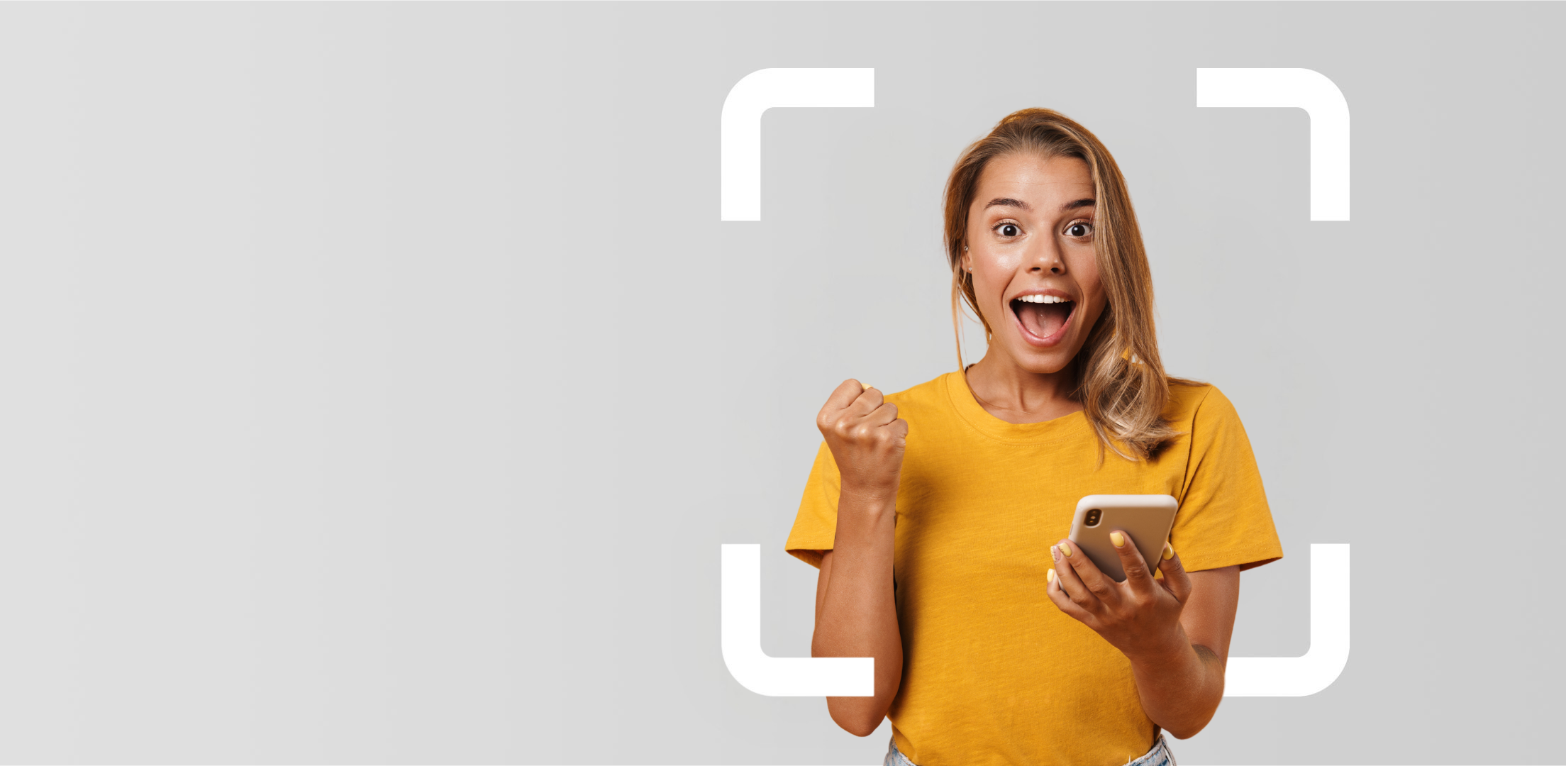 Happy, smiling woman holding a phone